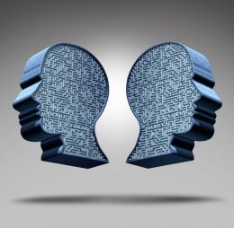 Two heads facing opposite directions symbolizing bipolar schizophrenia, highlighting the differences between bipolar disorder and schizophrenia and addressing the question, “is bipolar schizophrenia?