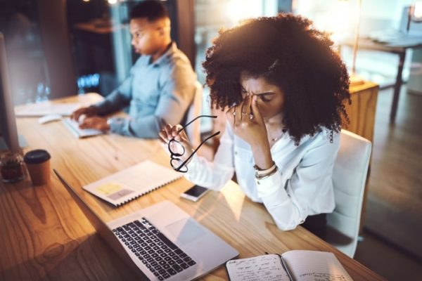 Woman feeling anxious at work.