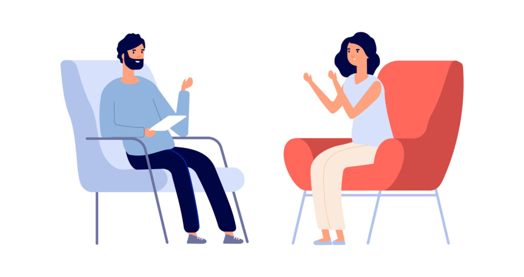 Two people talking in a therapy session.
